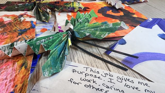 A group of paper butterflies with inspirational messages