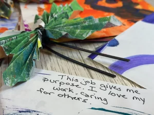 Paper butterfly and message of support for DCWs.